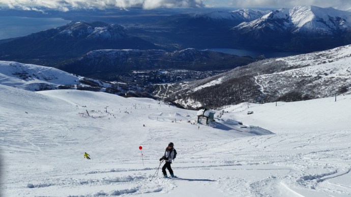 Donna looks up at me near the top of Nubes with gorgeous Lake Nahuel Huapi in the background.
