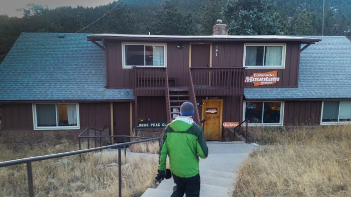 Colin walking towards the entrance of the Colorado Mountain School in Estes Park