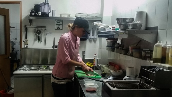 Matti working in the kitchen of her sandwicheria